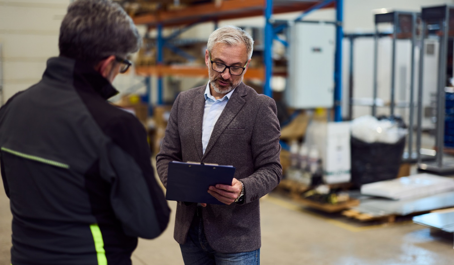 two workers discussing lead generation for freight companies and warehouse